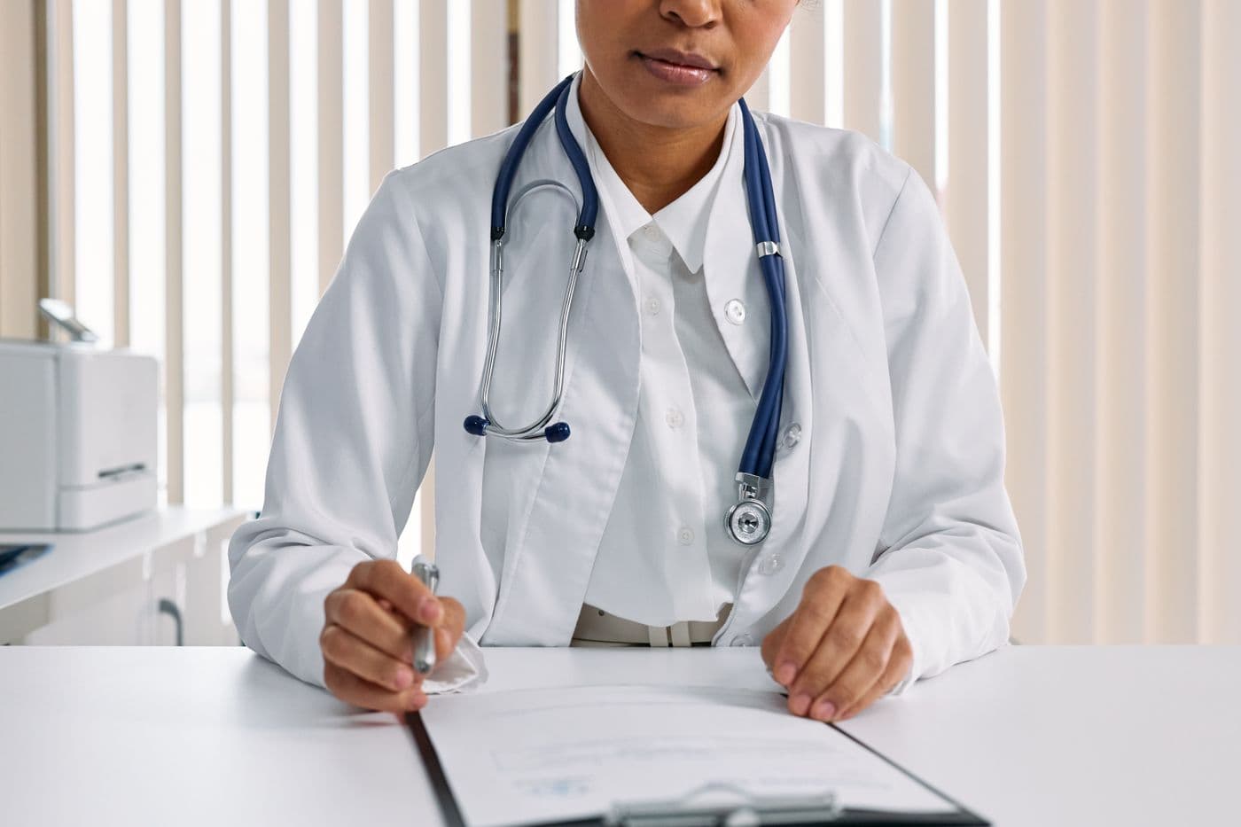 Provider reviewing a patient chart during a functional medicine consultation